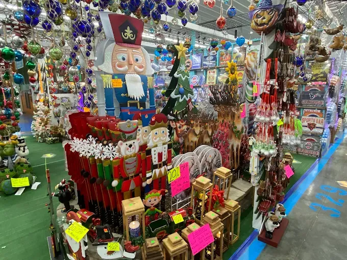 christmas-themed store aisle filled with colorful decorations, including nutcracker figures, ornaments, and sale signs at walnut creek marketplace