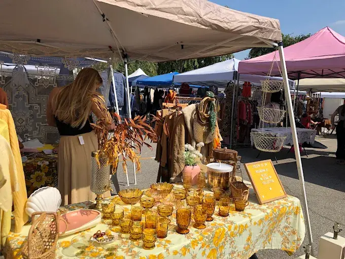 vintage amber glassware on display at a sunny outdoor stall during the silverlake flea in pennsylvania